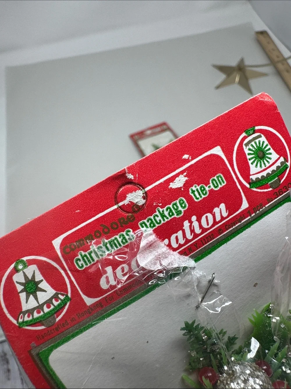 VINTAGE COMMODORE CHRISTMAS GIFT TIE ONS LOT OF 4 FLAWS PLASTIC BELLS PINE SPRIG
